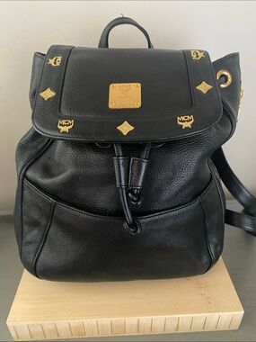 MCM Black Pebbled Leather Backpack with Gold Emblem Hardwarer